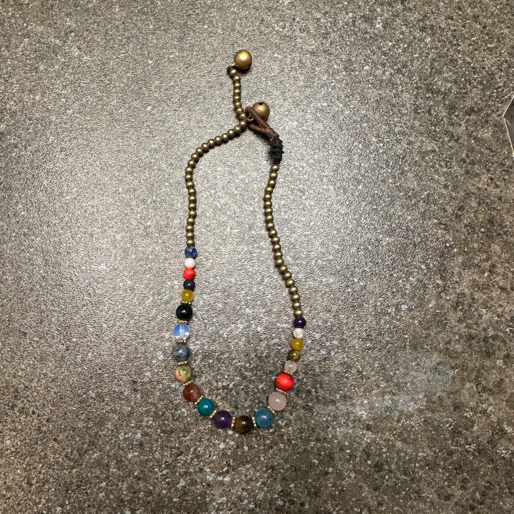 Chakra anklet with colorful beads. It has little bells that ring.